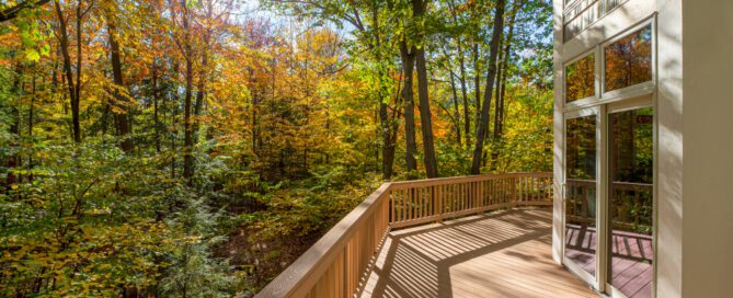 beautiful wood deck in the woods that matches the exterior of the house in nashville, tn